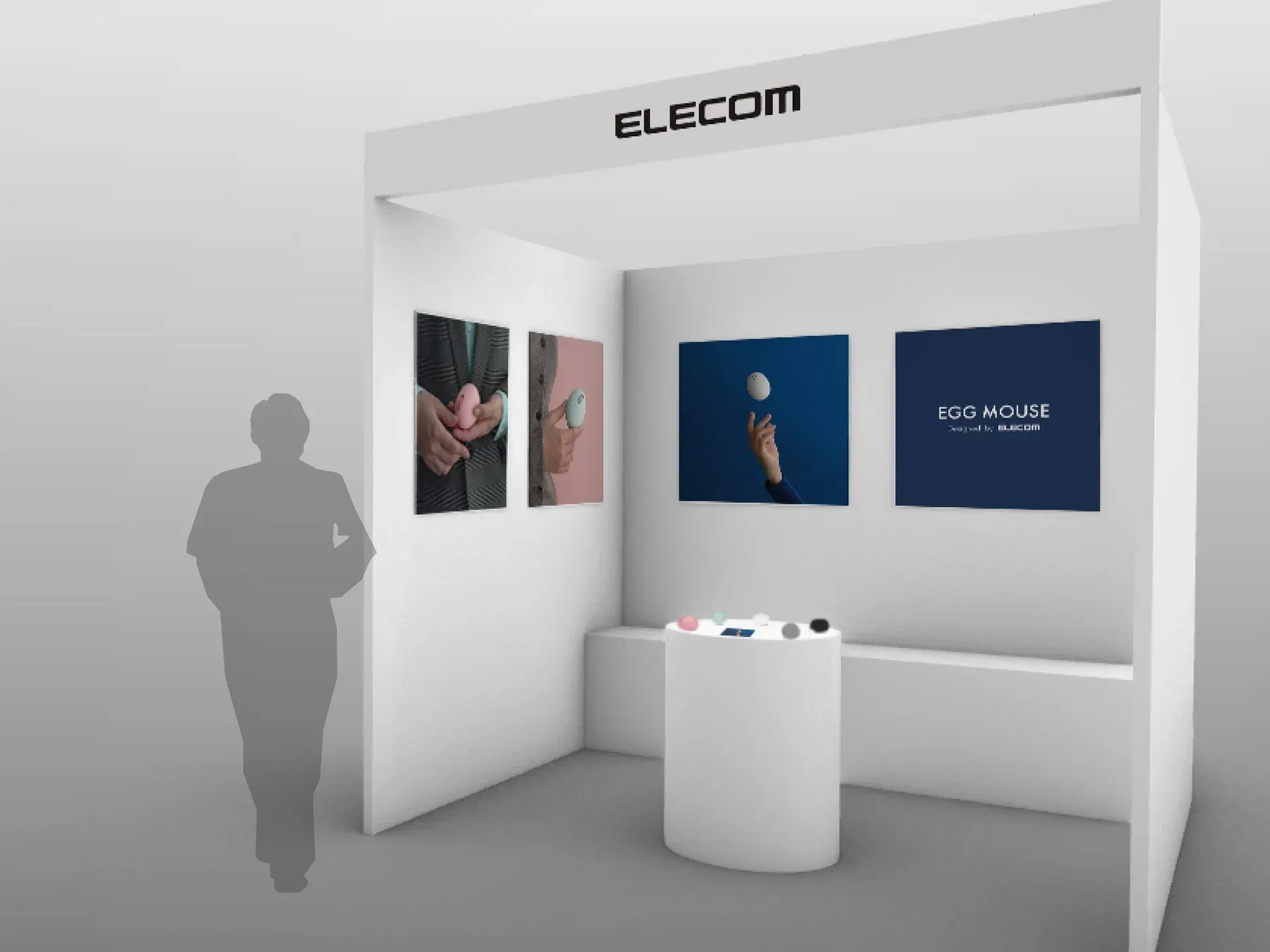 ELECOMの展示ブースで、卵型デザインの「EGG MOUSE」が紹介されています