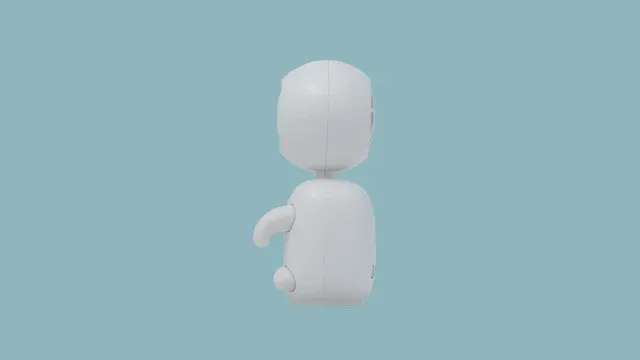 可愛らしい白いロボットのようなキャラクターが横向きに立っている